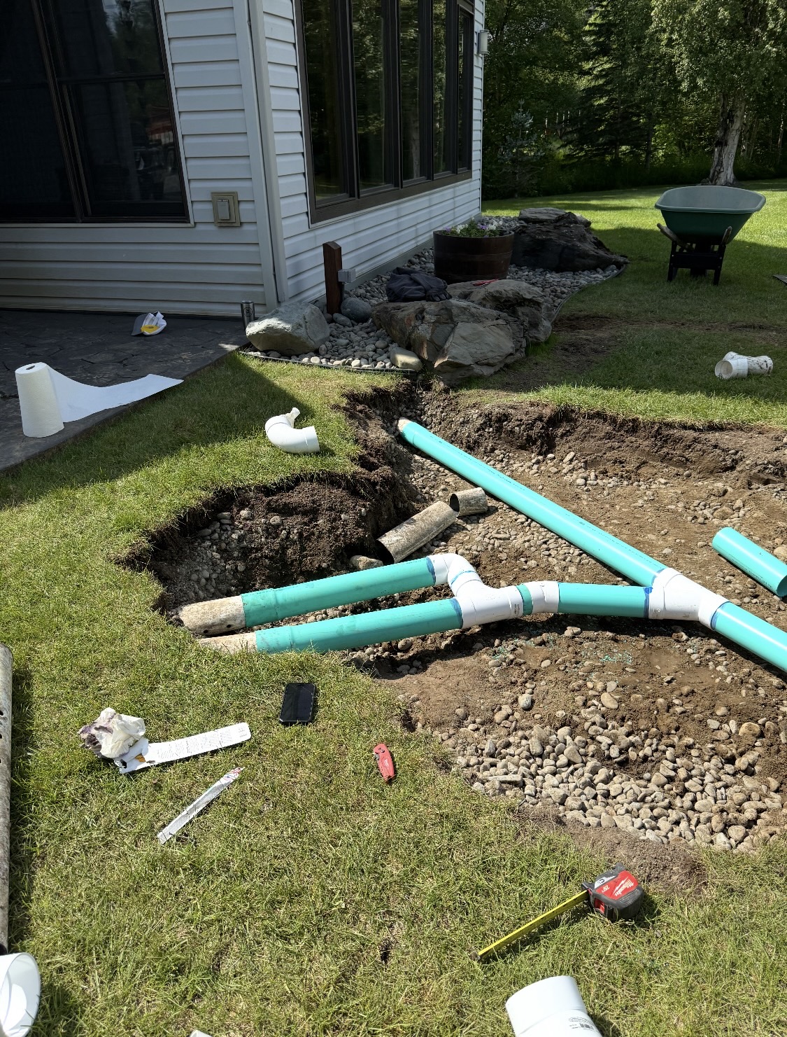 Septic pipes laid in excavated yard during residential septic system installation